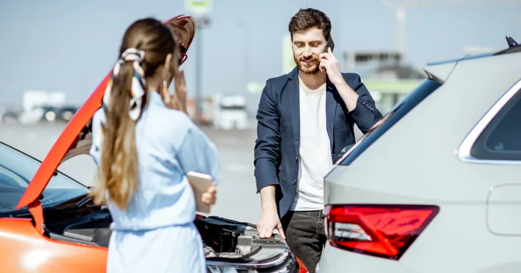 An image showing a person getting into an auto accident and calling an accident lawyer in Alabama.